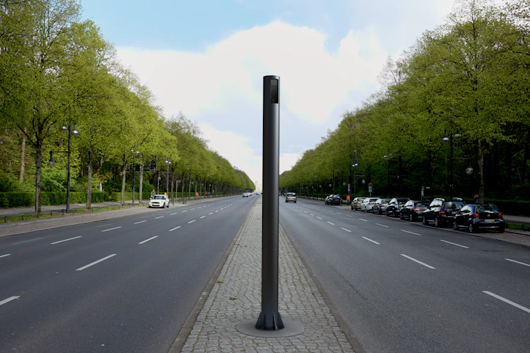 smart light pole in the middle of a tree-lined street