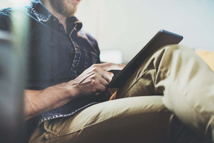 A man on a tablet computer.