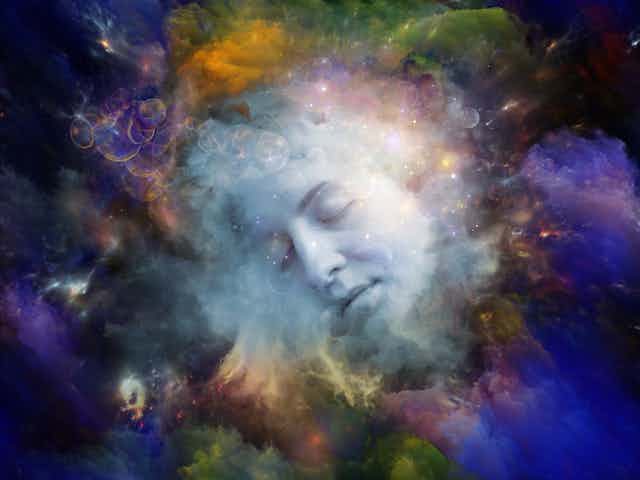 Artist's concept of colourful clouds with a face in the centre.