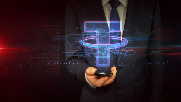 Businessman holding the Tether logo
