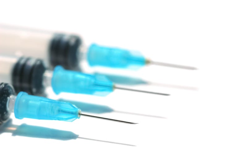 A row of hypodermic needles.