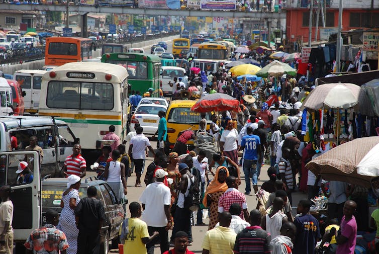 A crowded street with cars in Ghana