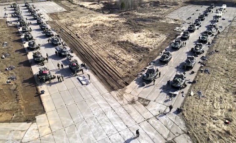 Russian military vehicles lined up on the road for military drills.