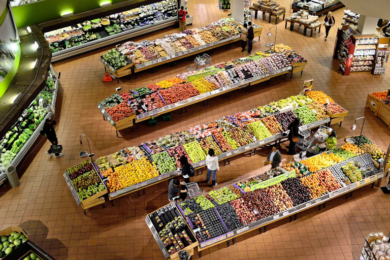 People shopping at a grocery store, shot from above
