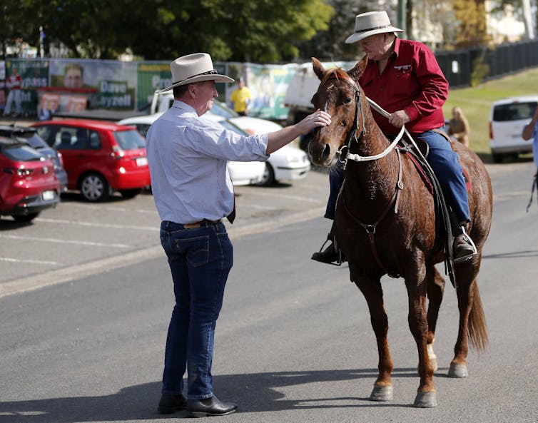 Barnaby Joyce talks to a man on a horse during the Upper Hunter byelection in May 2021.