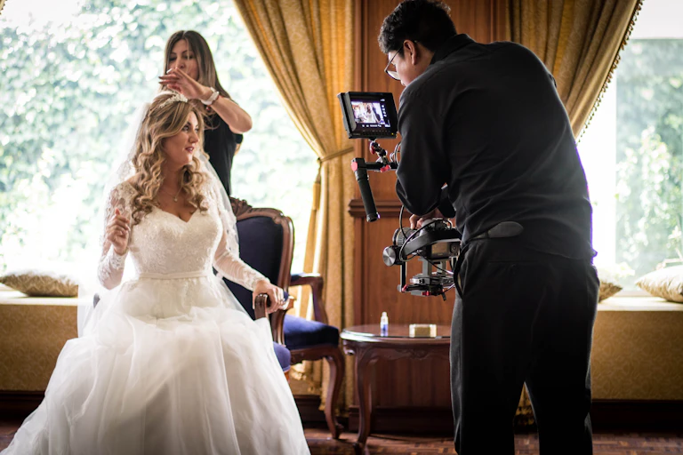 A wedding videographer at work
