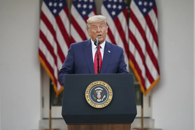 Donald Trump speaking at a press conference