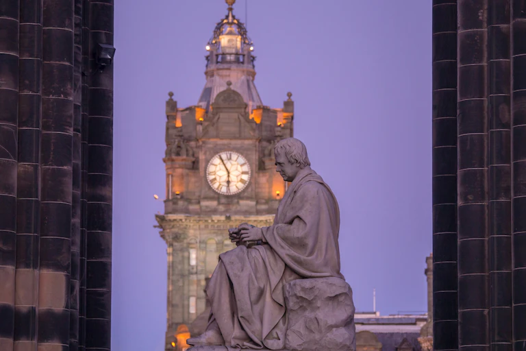Statue of Walter Scott beneath the Scott Monument on Princes Street Edinburgh.