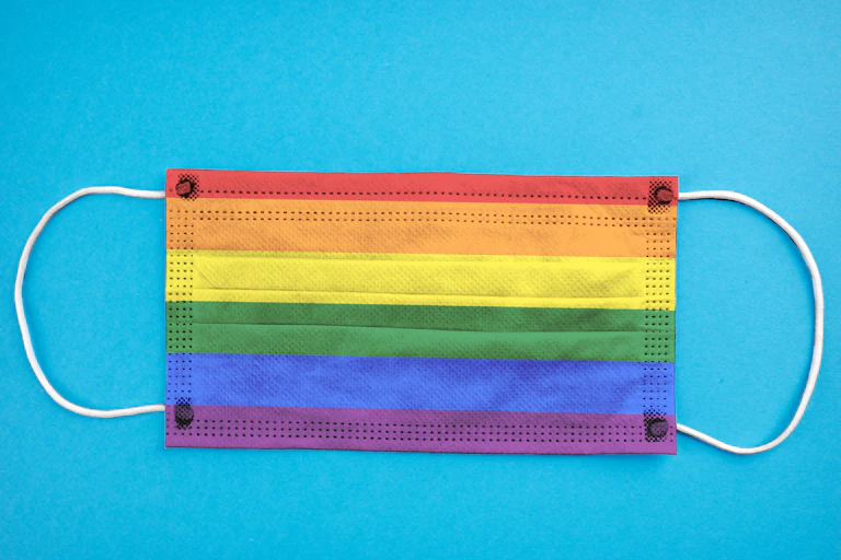 LGBTQ rainbow facemark against a blue background