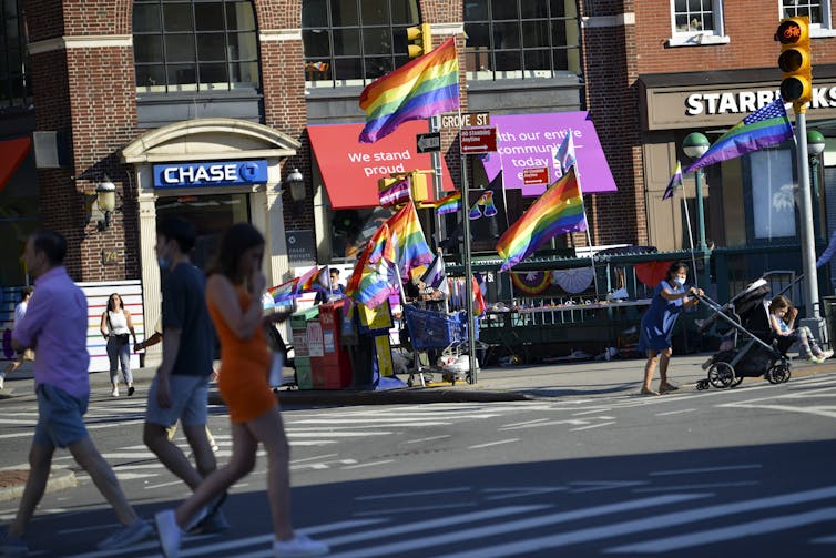 Street scene with lots of pride flags flying