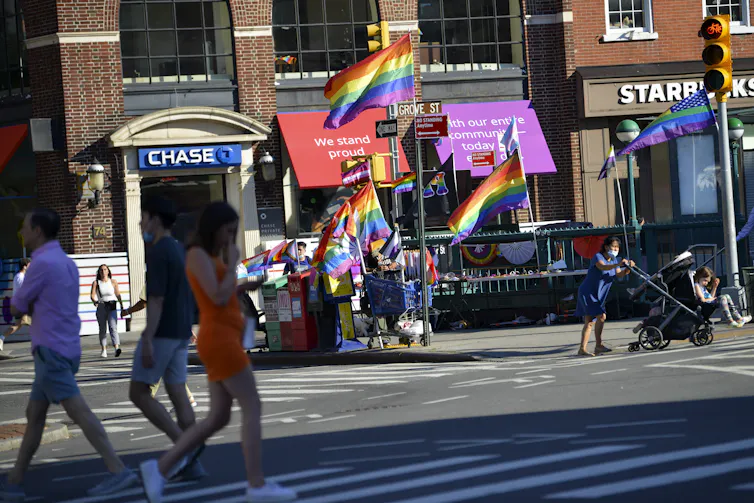 Street scene with lots of pride flags flying