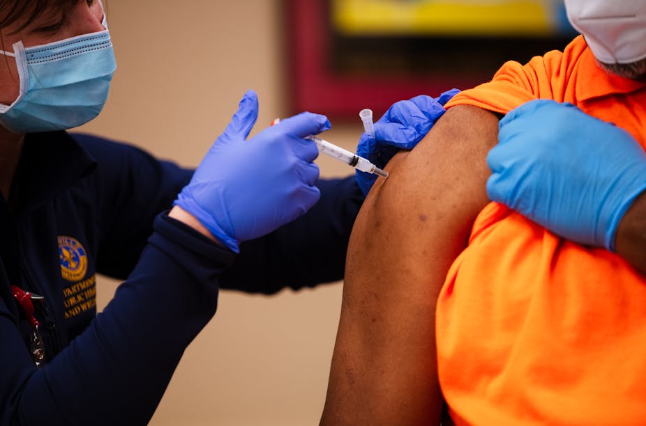 Luther Brown, founder of the gun safety advocacy organization, Little Hands, Little Feet, received the Moderna COVID-19 vaccine at the Louisville Urban League on January 20, 2021 in Louisville, Kentucky. Leaders of the Black community received the shots Wednesday to establish trust in the vaccination process