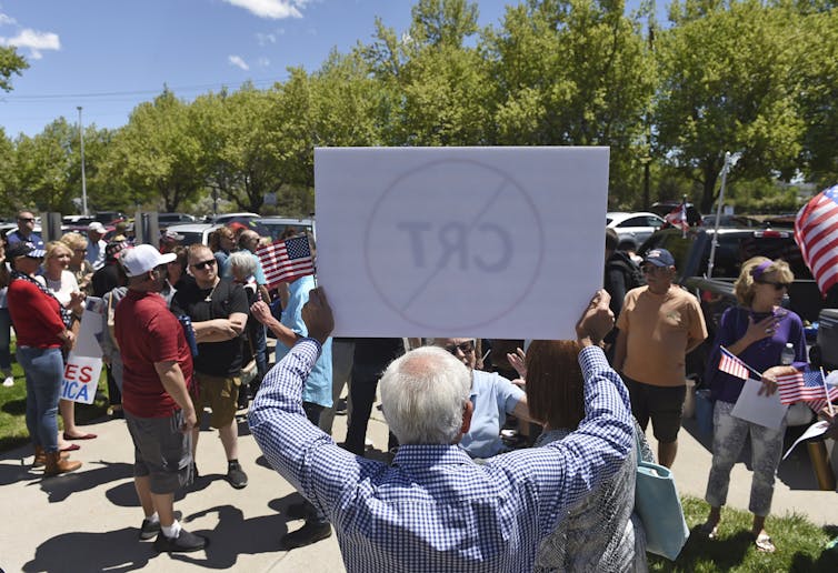 Protestors in the US holding up a 'no CRT' sign.