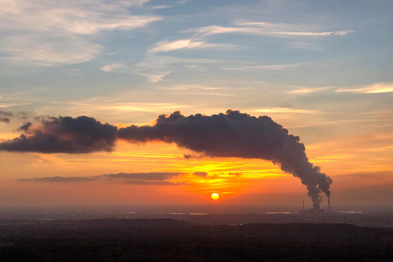 Industrial emissions at sunset