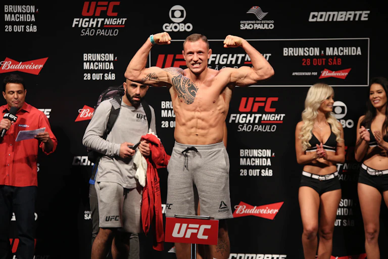 A fighter flexes his biceps during a UFC weigh-in.