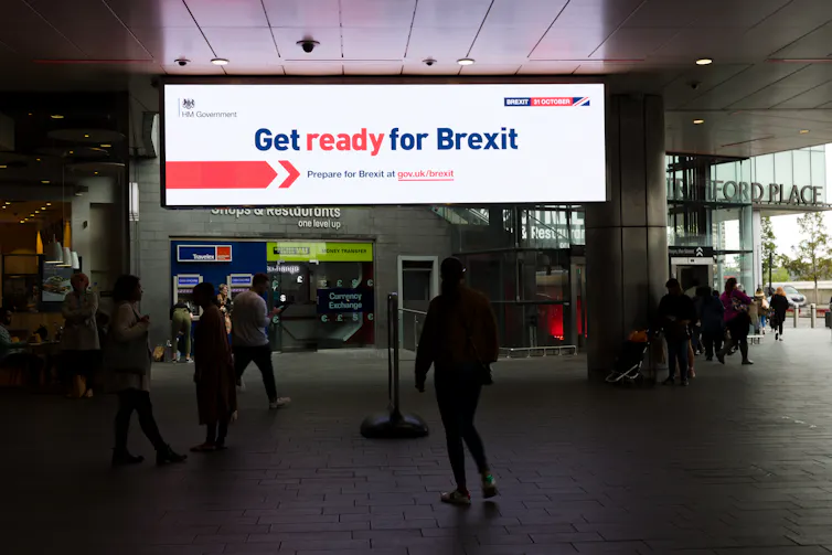 A 'Get ready for Brexit' advertisement glows on a billboard in a UK shopping centre