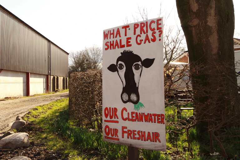 A hand-painted antif-fracking poster at the entrance to a Lancashire farmyard
