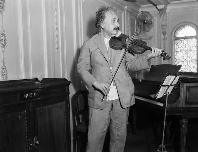 Picture of Albert Einstein playing the violin.