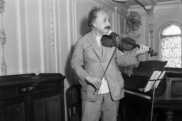 Picture of Albert Einstein playing the violin.