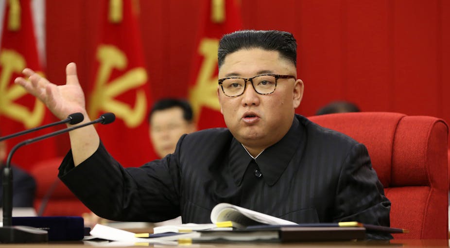 North Korean leader Kim Jong-un presiding over the opening of the third Plenary Meeting of the 8th Central Committee of the Workers' Party of Korea