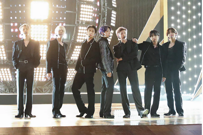 Members of BTS perform onstage