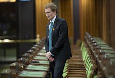 Indigenous Services Minister Marc Miller stands during a moment of silence in the House of Commons.