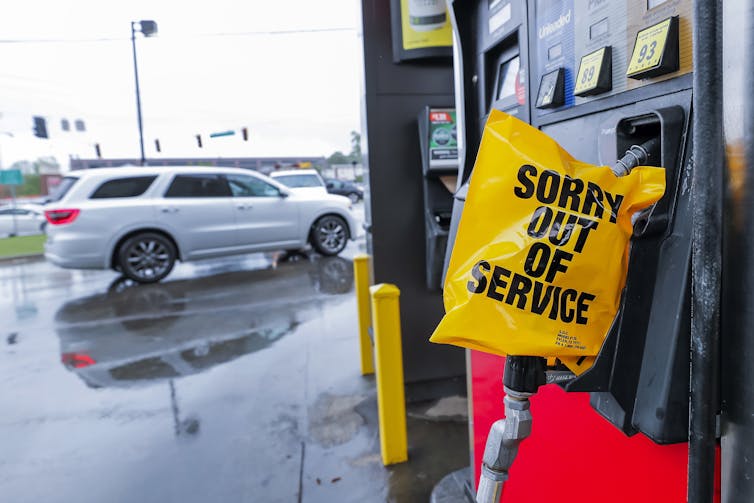 Fuel pump with sign saying 'Sorry Out Of Service'