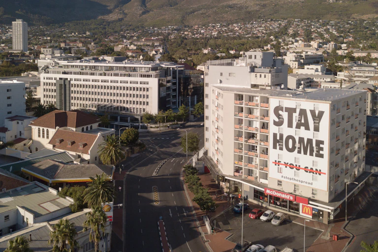 Cape Town during lockdown, with a sign on a building saying 'Stay Home'