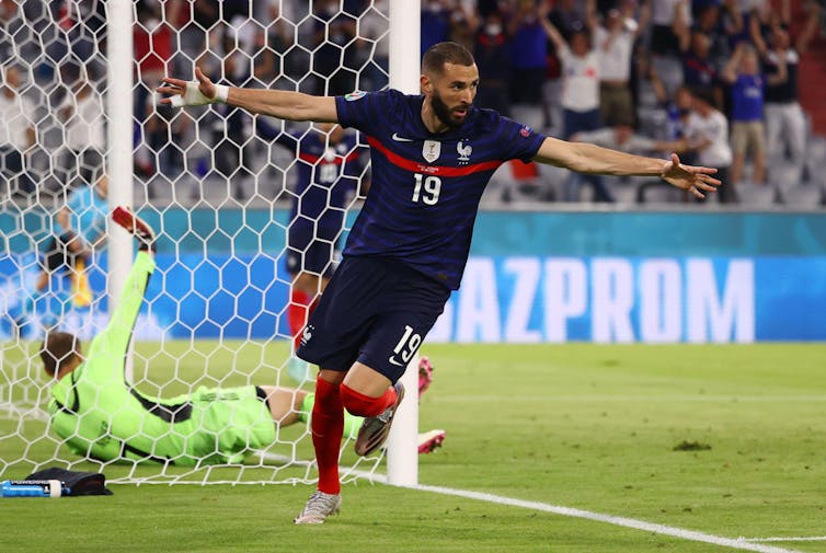 A footballer celebrates a goal.