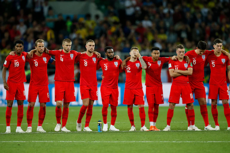 England team watching penalty shootout.