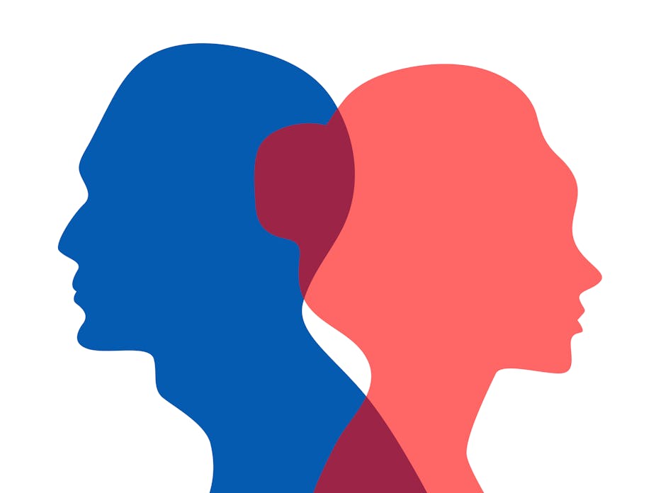 Silhouette of a man and a woman going in opposite directions.