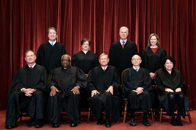 Supreme Court Justices pose during a group photo of the Justices at the Supreme Court in Washington, DC on April 23, 2021