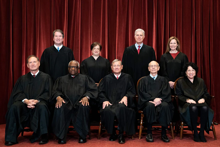 Supreme Court Justices pose during a group photo of the Justices at the Supreme Court in Washington, DC on April 23, 2021