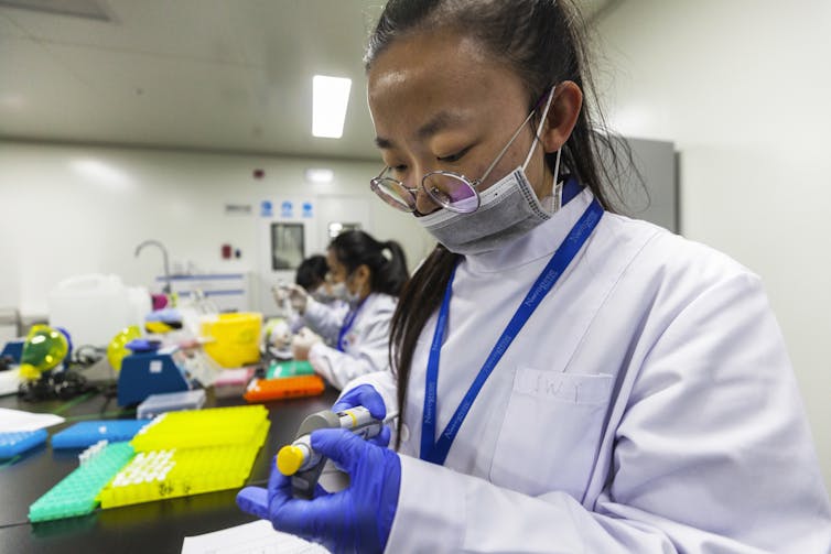 woman in lab coat