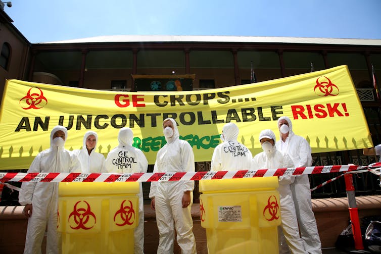 protesters in front of sign