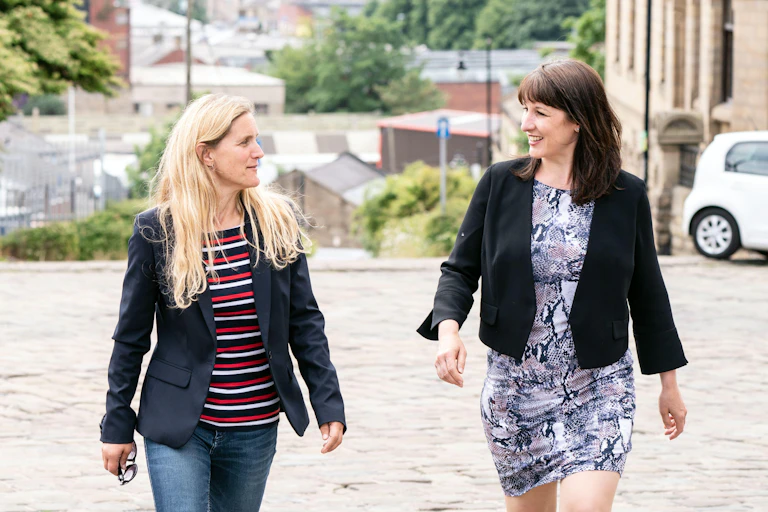 Labour candidate Kim Leadbeater and shadow chancellor Rachel Reeves walking up a hill in the contested seat of Batley in West Yorkshire.