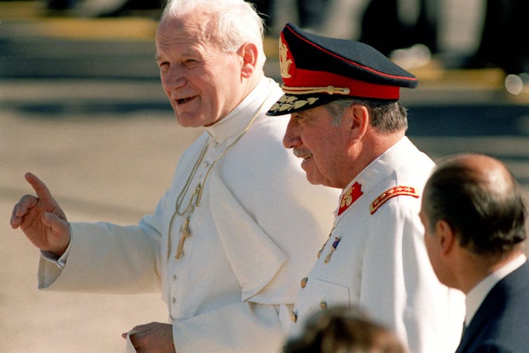 Pope John Paul II, left, with Chilean President Gen. Augusto Pinochet in Santiago, Chile on April 1, 1987.