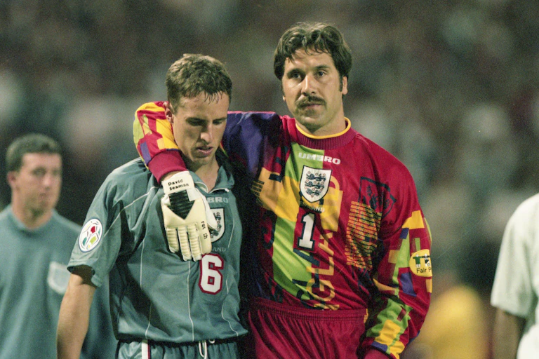 Goalkeeper David Seaman with his arm around Gareth Southgate