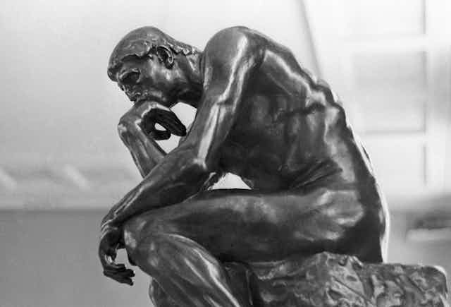 Black and white photograph of The Thinker. 
