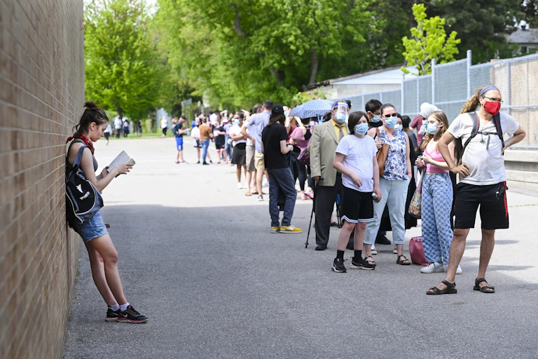 Families lined up in a schoolyard