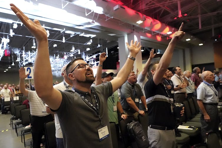 People take part in a worship service during the annual Southern Baptist Convention meeting in June 2021, in Nashville, Tennessee.