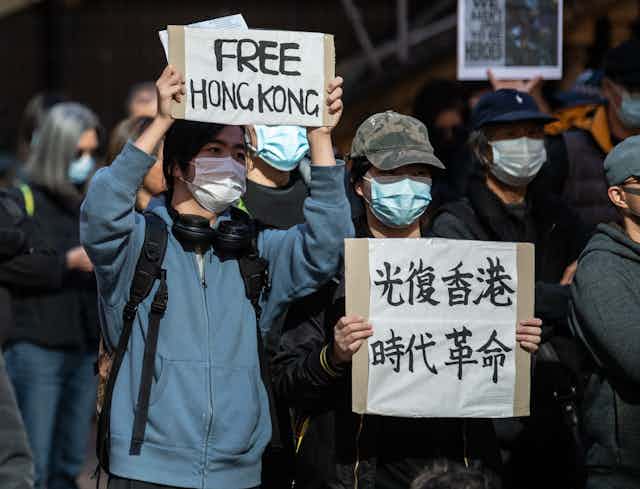 Protester holding up "Free Hong Kong" sign