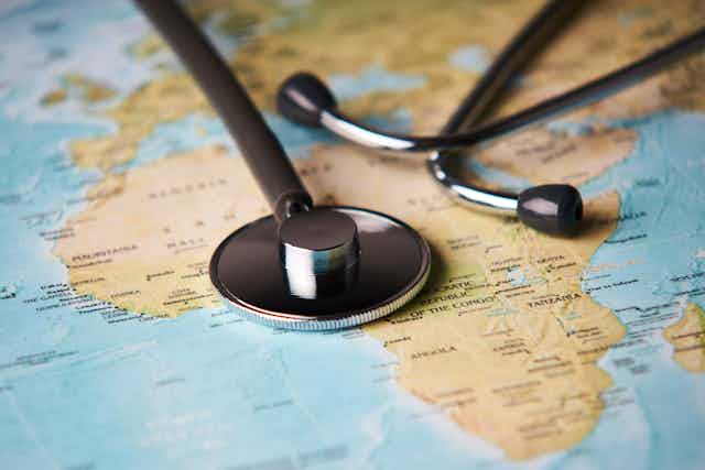 Medical stethoscope over map of Africa