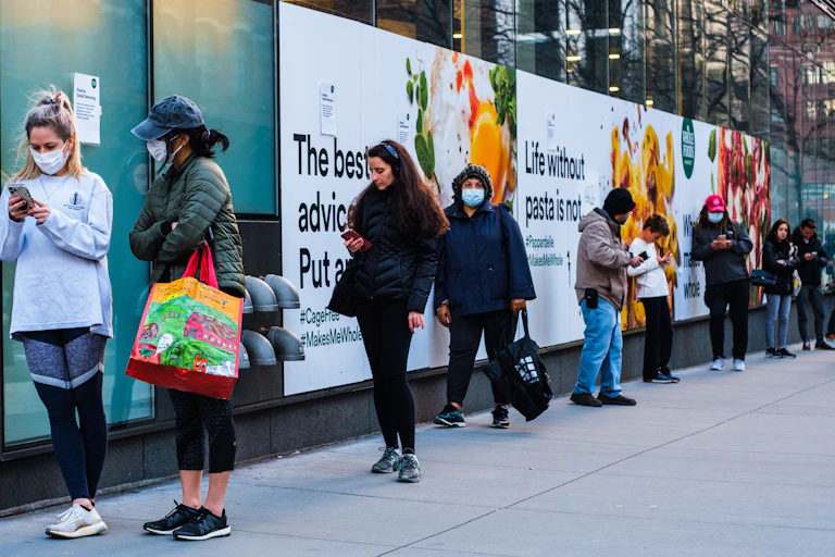 Image of people queuing during the pandemic.