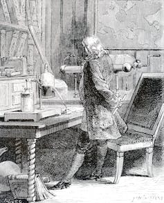 etching of Franklin standing at a table in a lab