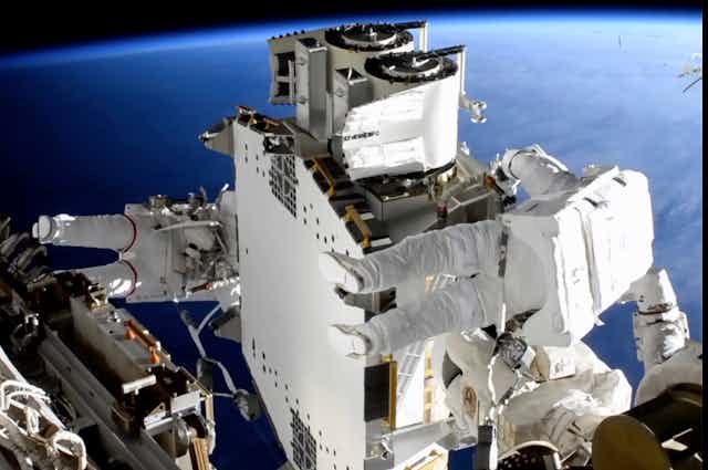 Astronauts Shane Kimbrough and Thomas Pasquet work on the International Space Station