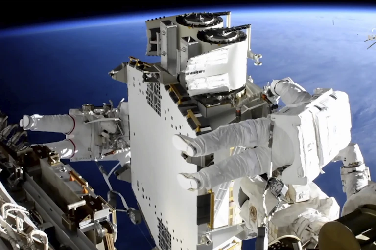 Astronauts Shane Kimbrough and Thomas Pasquet work on the International Space Station