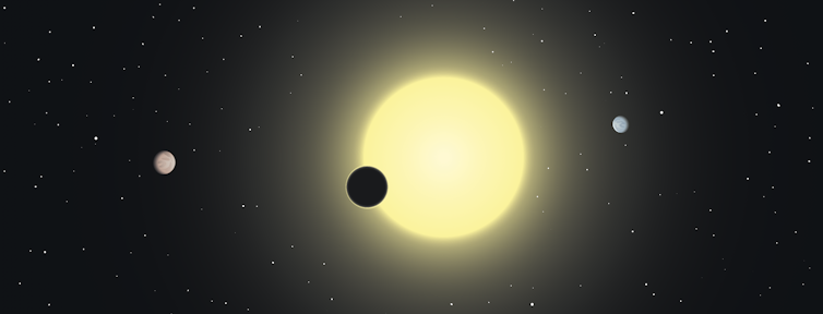 A drawing of a planet passing in front of its star.