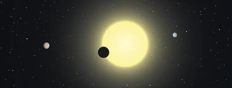 A drawing of a planet passing in front of its star.