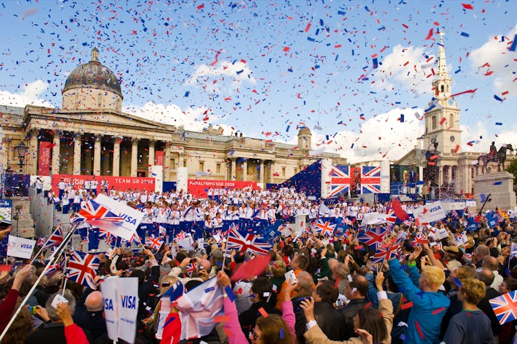 Crowds celebrate the 2008 GB team's medal haul on the Olympic Parade in London